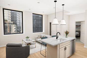 A modern kitchen with a marble countertop and a large window overlooking the city.